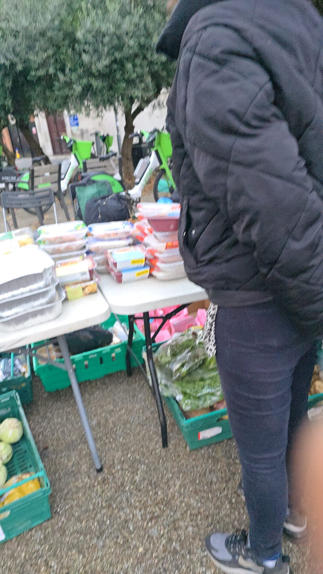 December 2025 Food Distribution - Prepared meals and fresh produce at distribution table