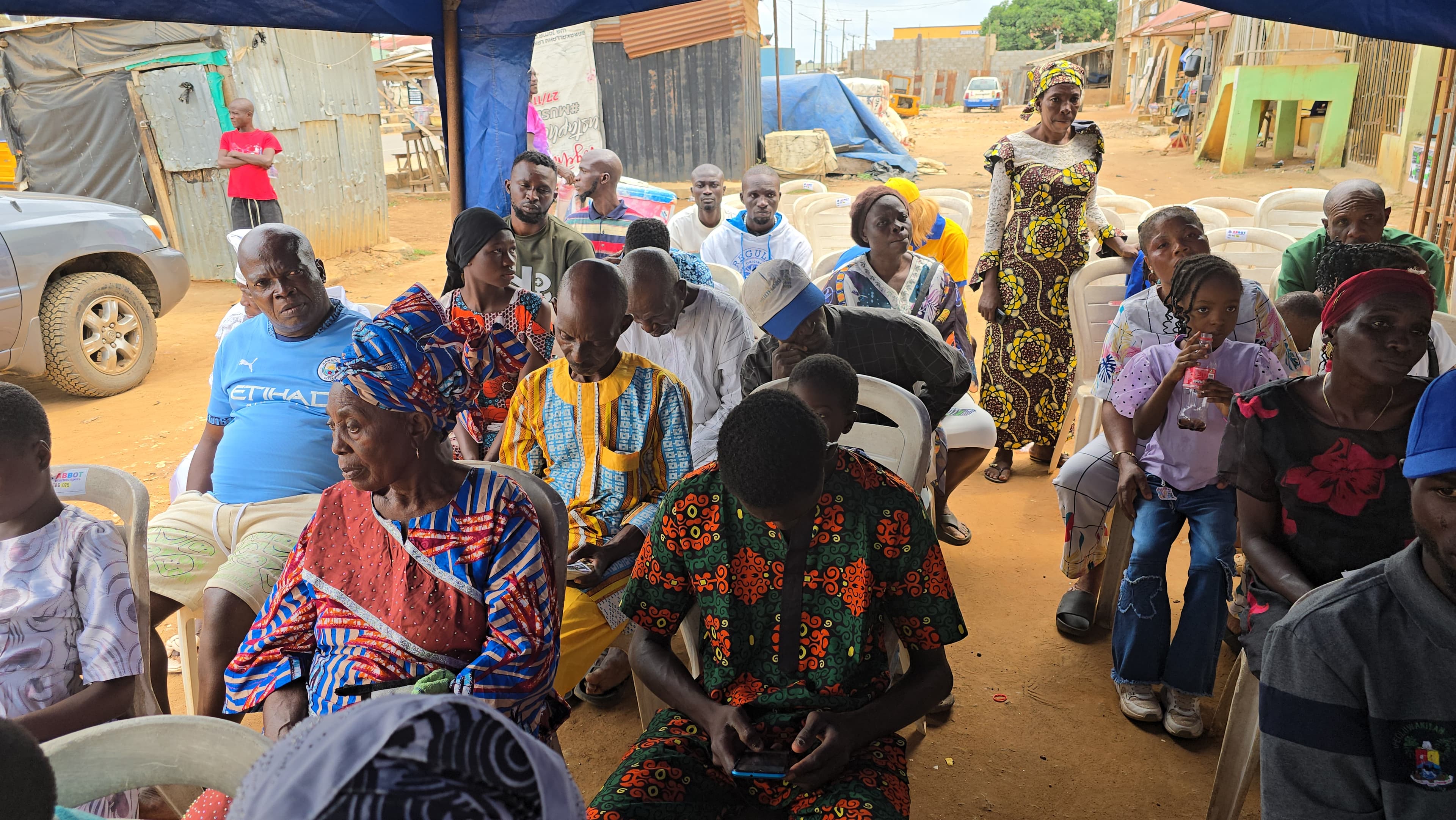 Community members gathered for soul winning outreach session