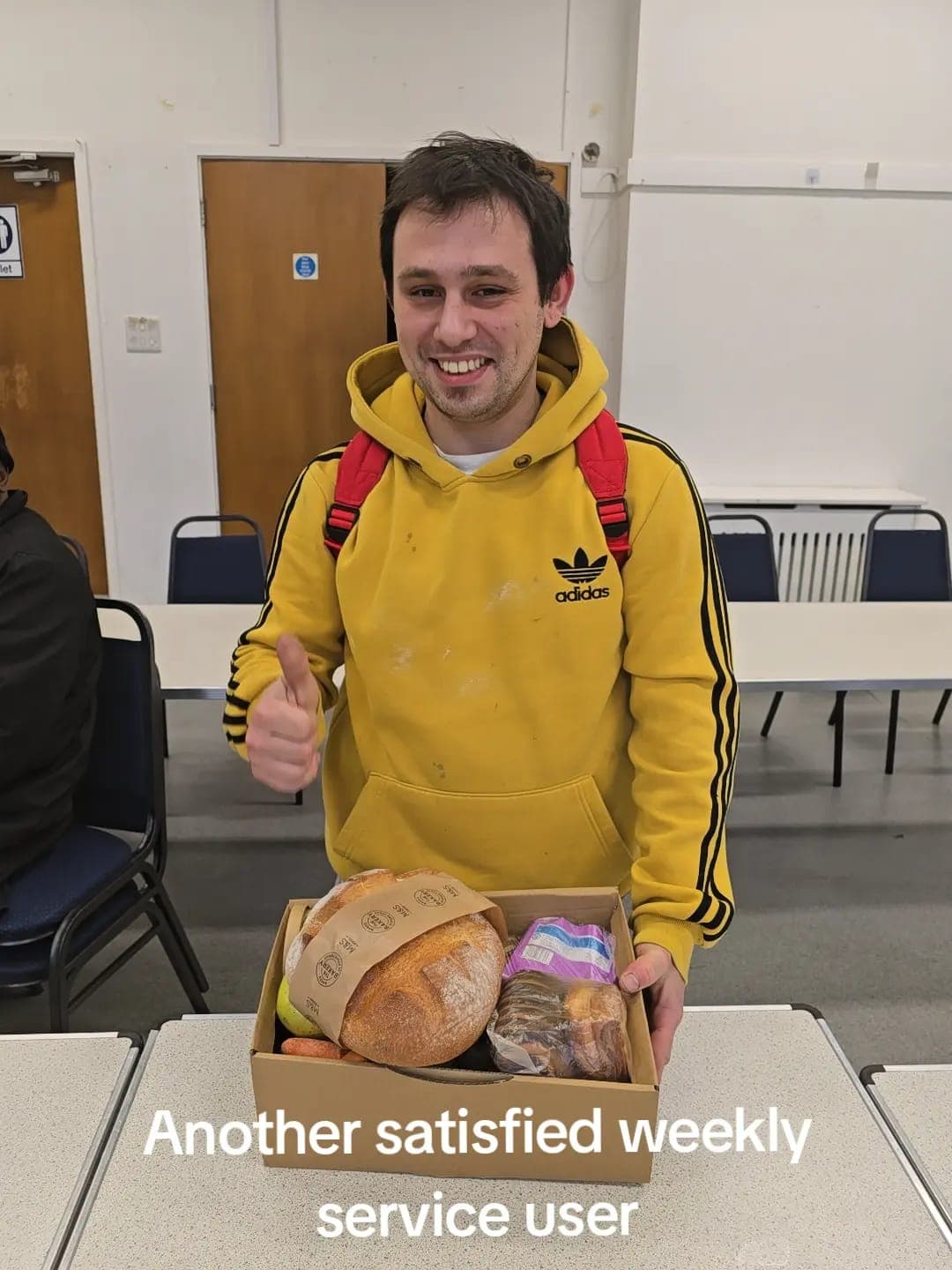 Simon volunteering at BMS food distribution