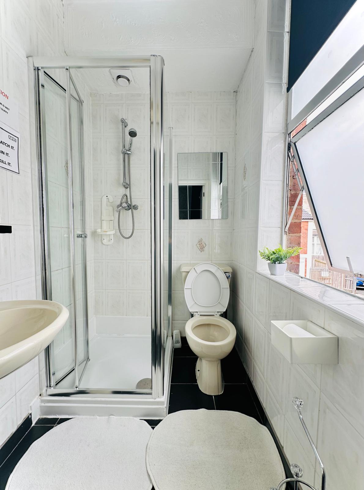 Clean modern bathroom with shower facilities