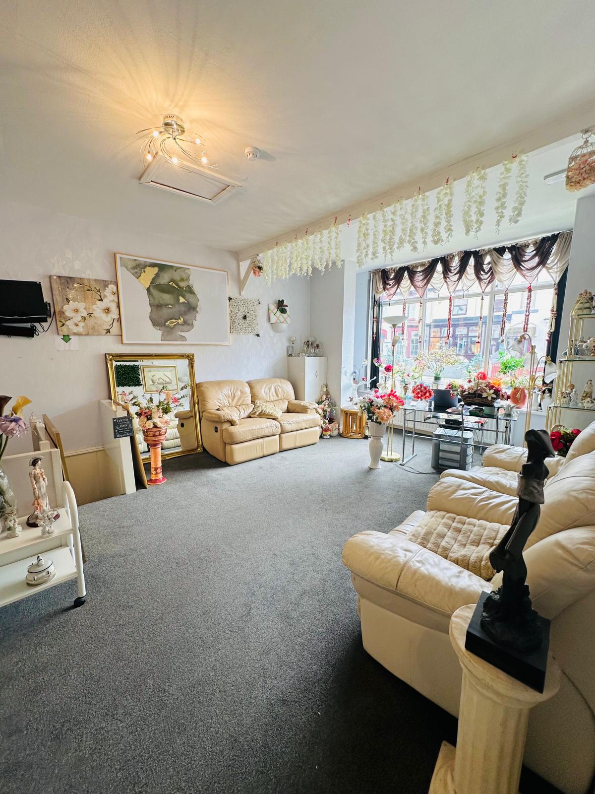 Comfortable lounge area with cream leather sofas