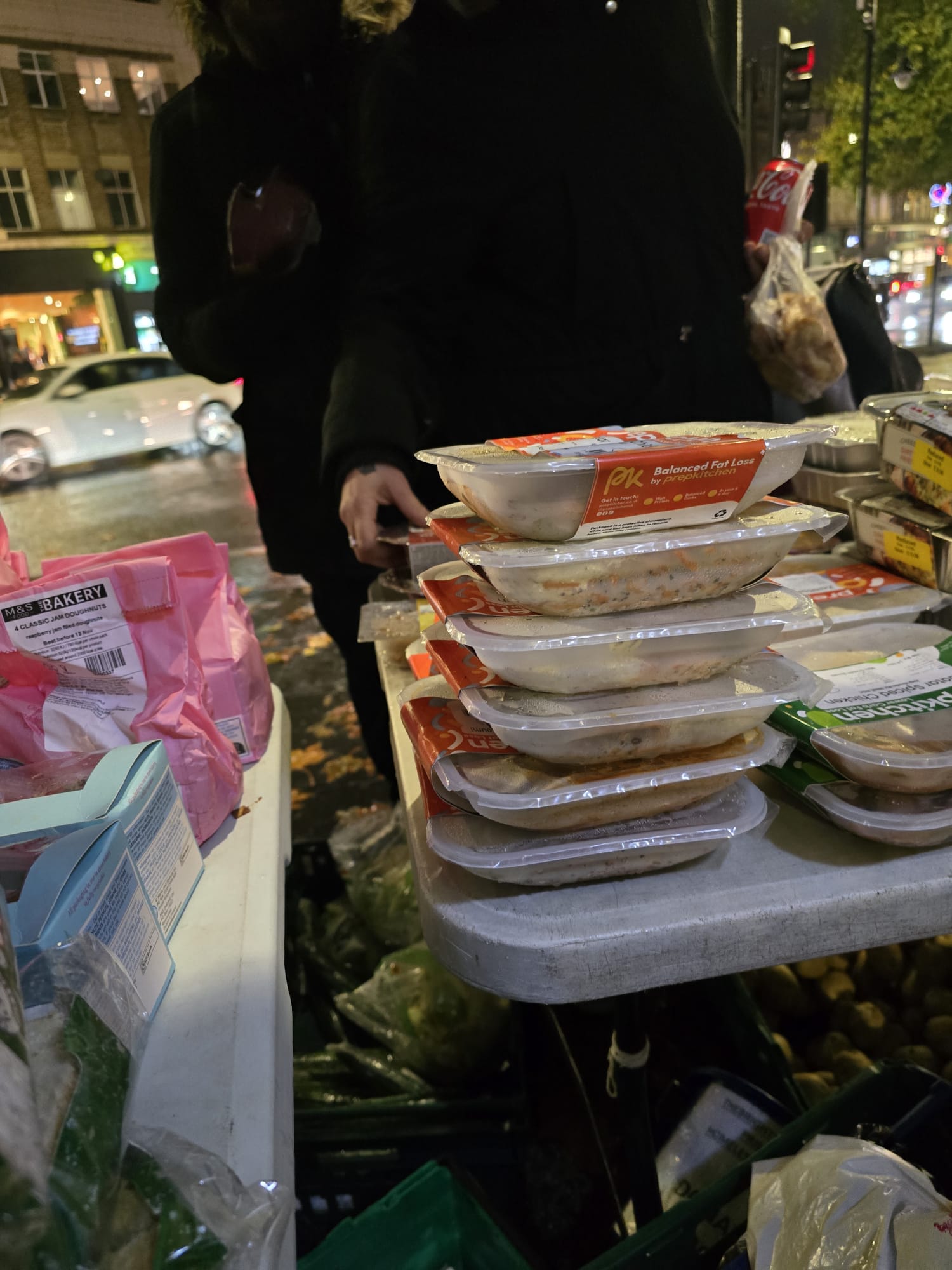 Stacked prepared meal containers ready for distribution